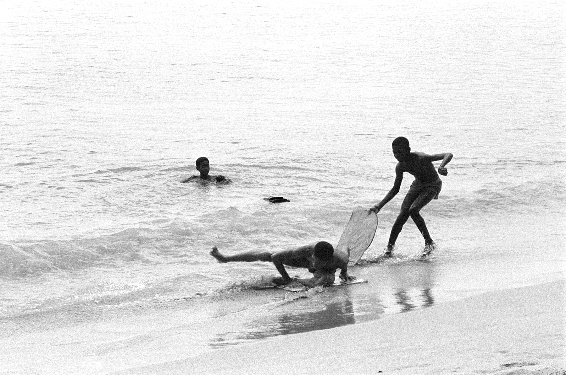 Photos by Francesca Phillips of boys playing on the beach in Barbados