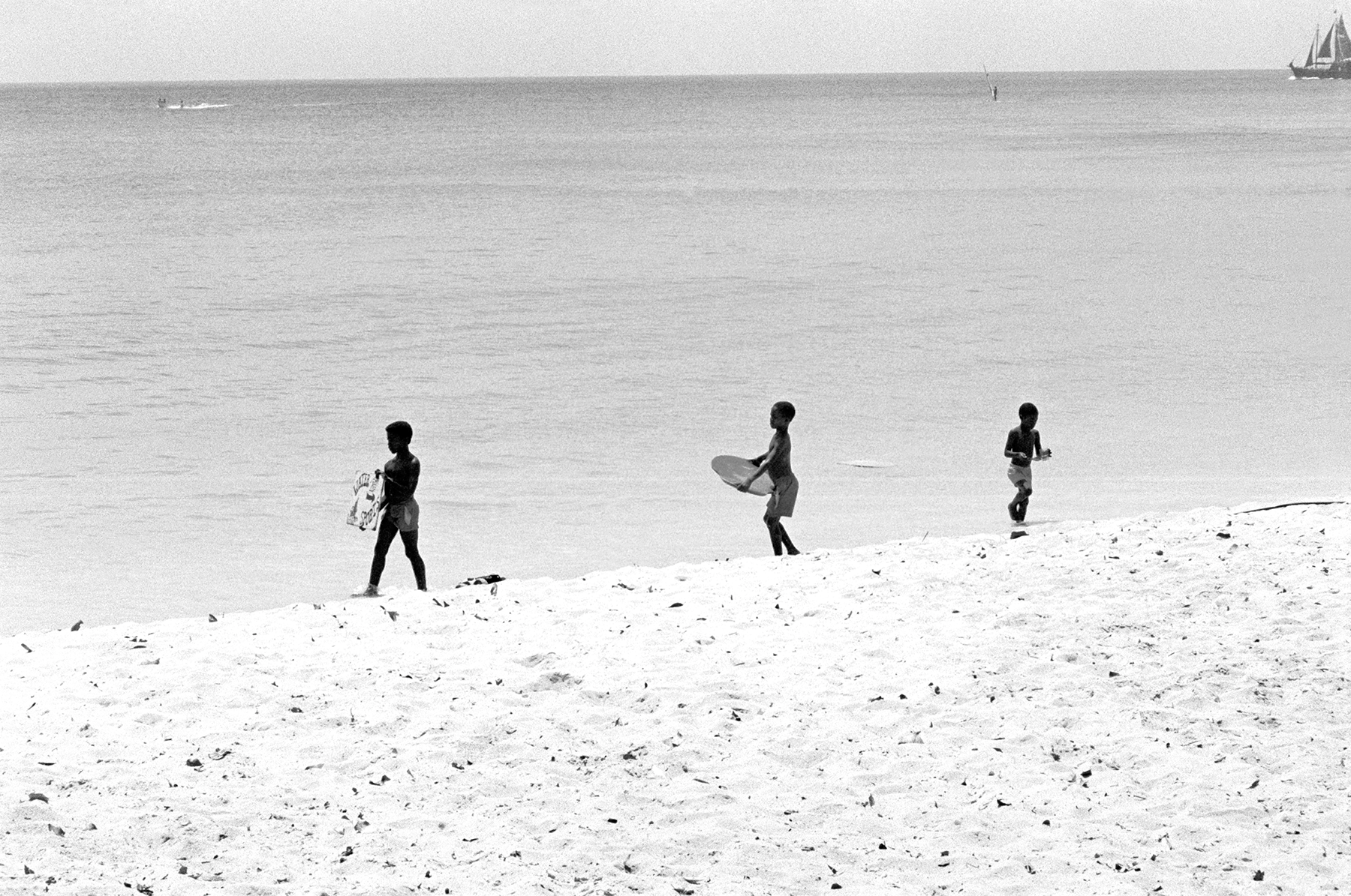 Photos by Francesca Phillips of boys playing on the beach in Barbados